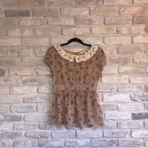 Retro inspired sheer top with cinched waist and lace collar detail